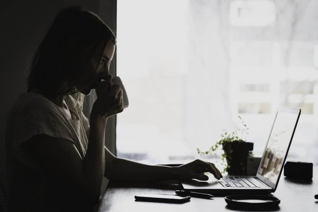 Woman typing on a laptop