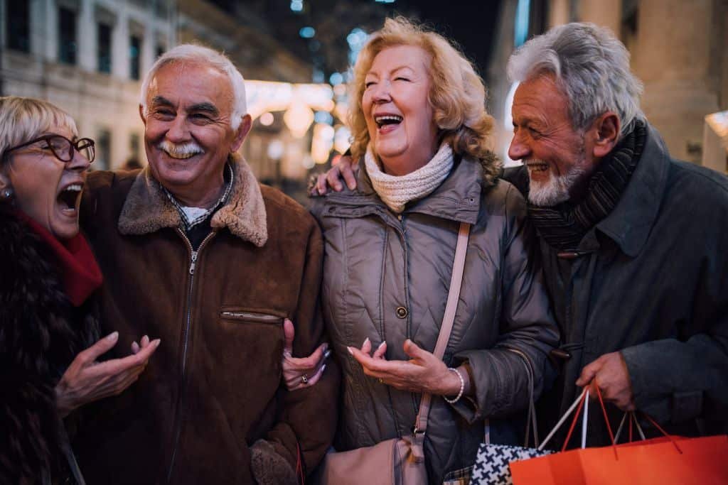 Group of older digital nomads laughing