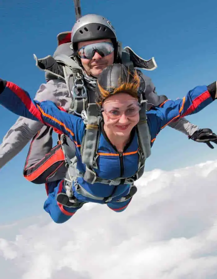 Man and woman tandem skydiving