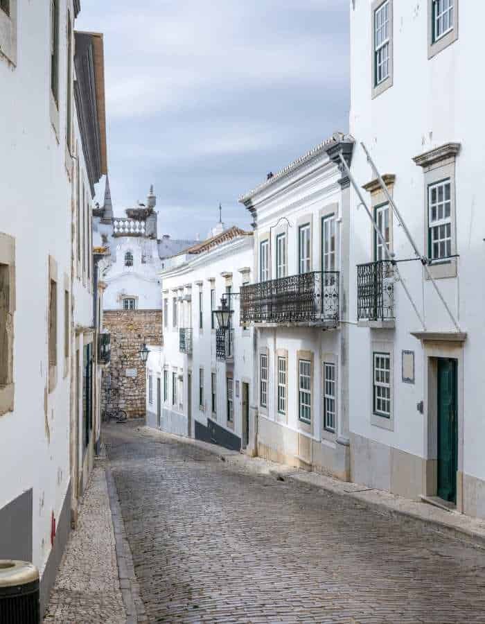 Christmas in Faro is quiet and understated, with a cobbled street lined by whitewashed buildings and traditional iron balconies. The soft winter light adds a peaceful charm to the historic old town, reflecting a more tranquil holiday atmosphere.