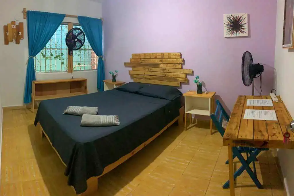 A private room with a bed and desk.