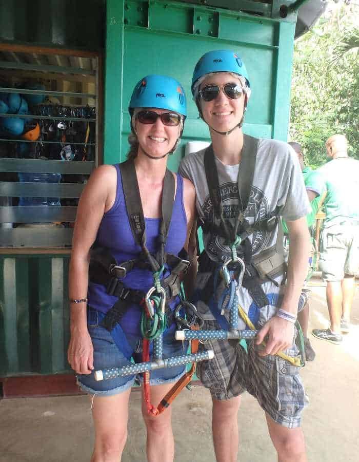Me and my son, Martin, ziplining in Cozumel. In our harnesses ready to go.