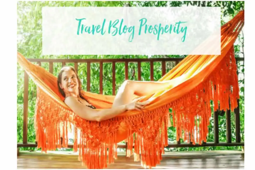 A woman relaxing in an orange hammock on a wooden deck surrounded by lush green trees. The text "Travel Blog Prosperity" is displayed in teal, handwritten-style font at the top of the image.